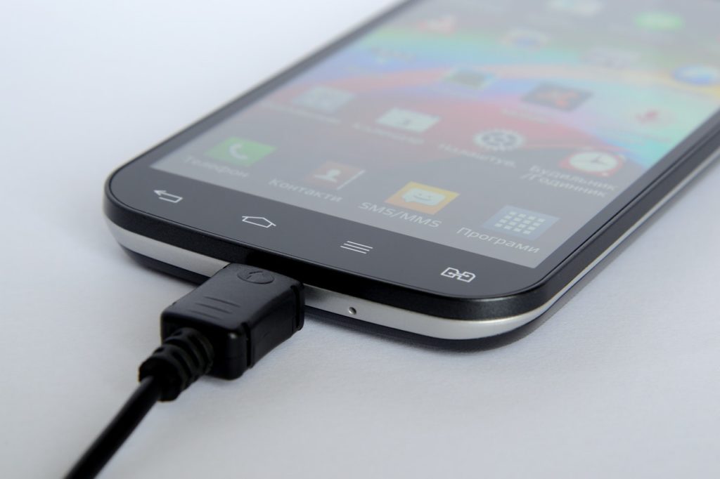 mobile phone connected with charger 